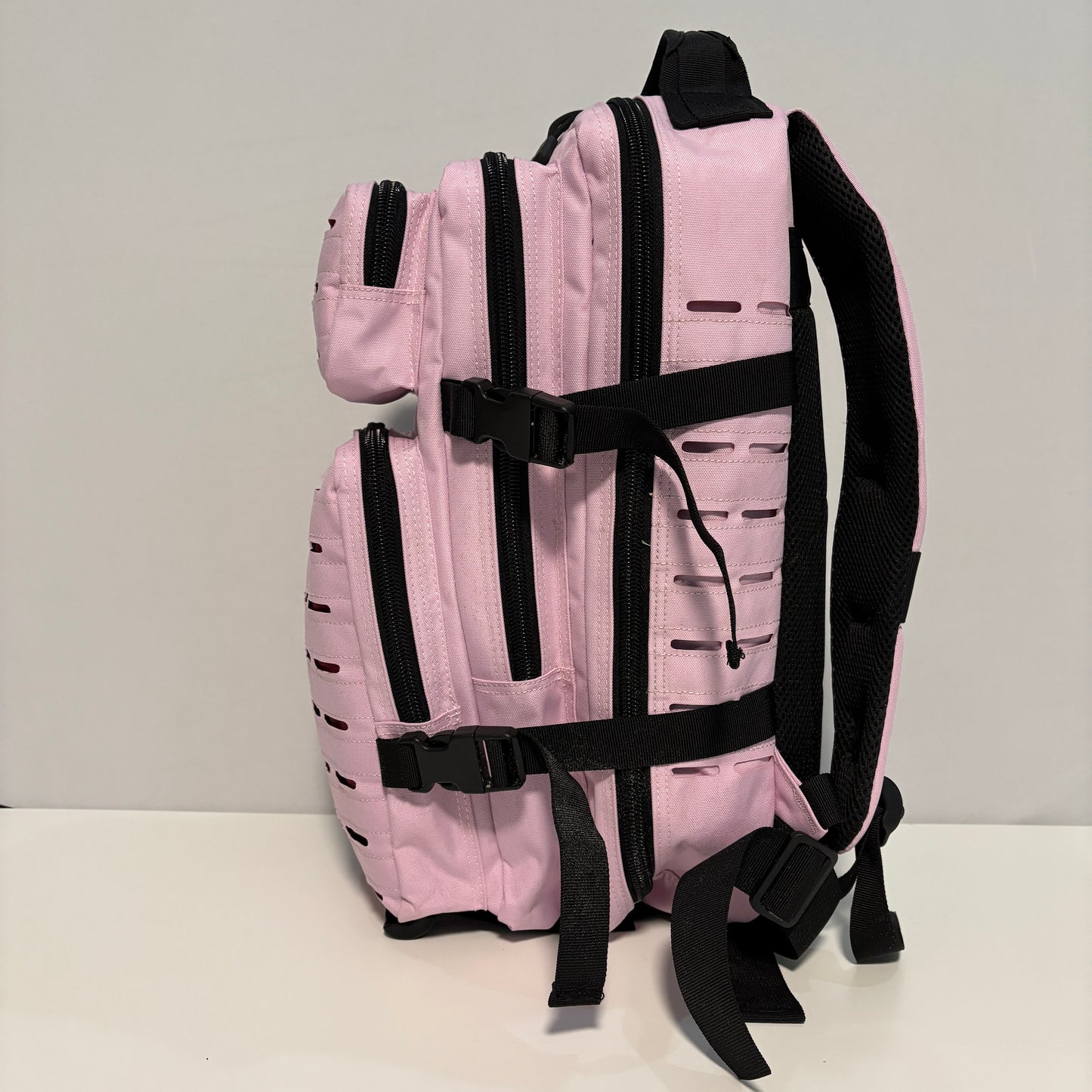 The COTTON CANDY Slimline Backpack with Laser Cut Molle in Pink - 25L