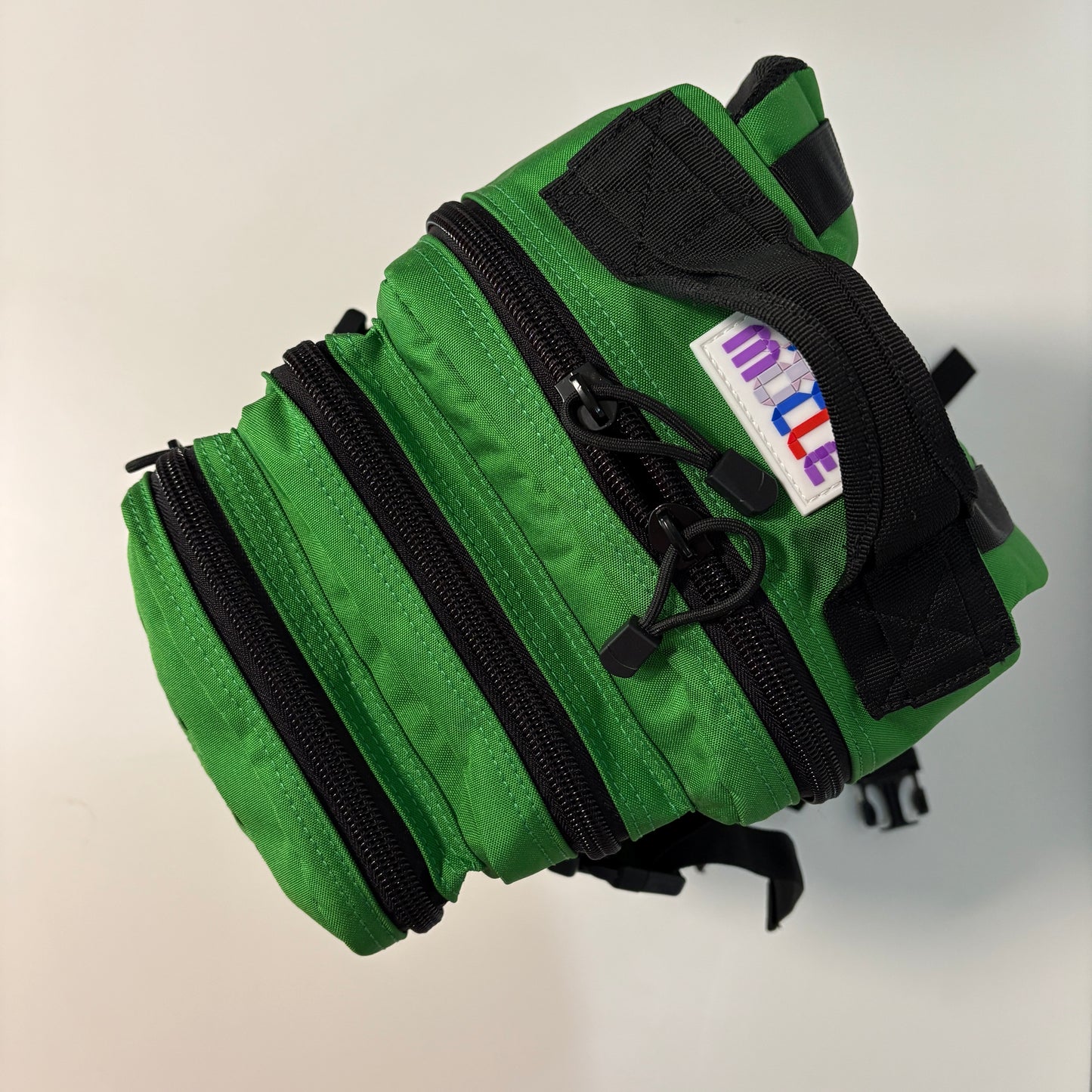 The FOREST Slimline Backpack with Laser Cut Molle in Green- 25L