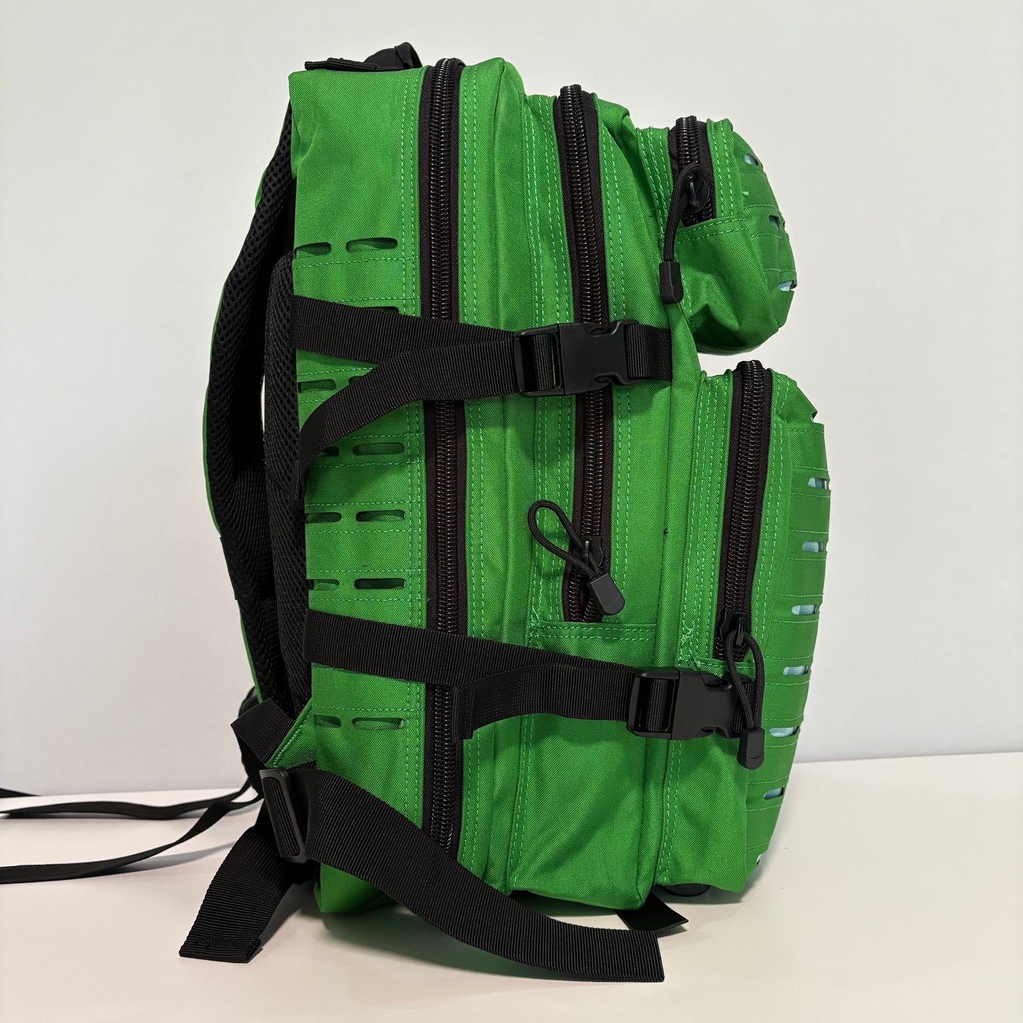 The FOREST Slimline Backpack with Laser Cut Molle in Green- 25L