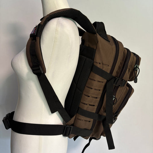 Brown tactical backpack on a mannequin with a plain background