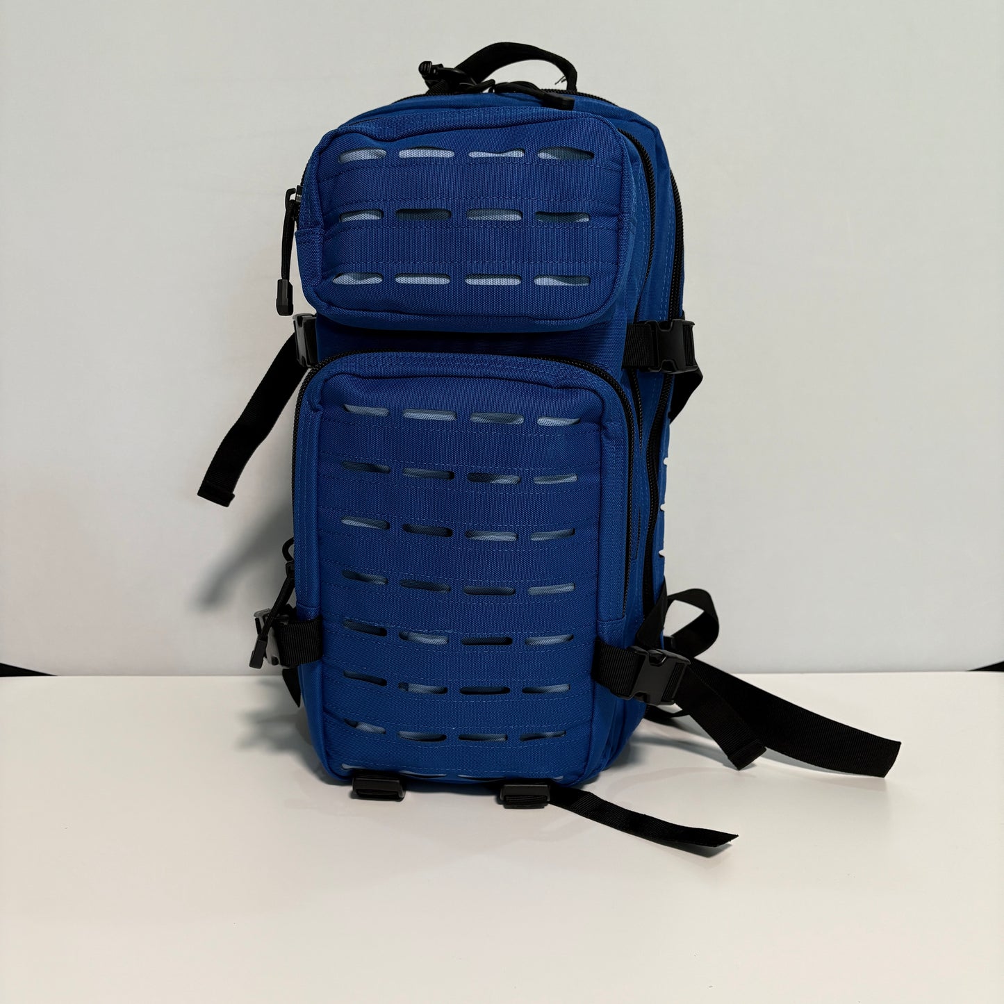 Blue tactical backpack on a white background