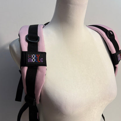 Pink and black harness on a mannequin with 'Holy Molle' label.