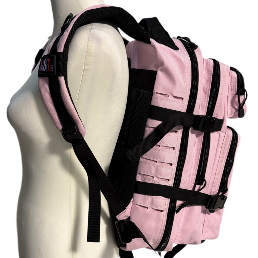 Pink backpack with black straps on a mannequin torso against a white background